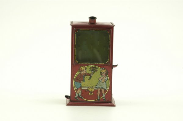 PINBALL VENDING BANK: Lithographed tin, an interesting design with glass view front and pinball slots on panel, graphics depict children on all sides, top features ball drop and coin slot. 6 1/2" h.
