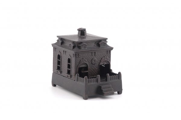 DOG ON TURNTABLE MECHANICAL BANK: Brown base, Judd Mfg. Co., circa 1870's, by the handle, the dog goes in and deposits penny, coming out of the other door for more.