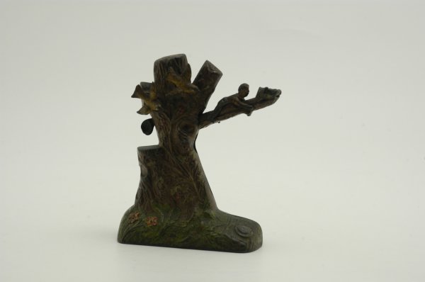 BOY ROBBING BIRD'S NEST MECHANICAL BANK: J & E Stevens Co., designed by Charles A. Bailey. Raise the limb of the tree to position, place a coin in the slot and press the lever. As the boy falls the coin disappears in the tree.