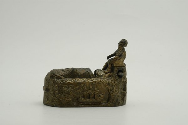 WORLD'S FAIR MECHANICAL BANK: J & E Stevens Co., designed by Charles A. Bailey, patented 10/10/1893. Place a coin in the slot at the feet of Columbus, press the lever, and as the coin disappears an Indian Chief suddenly leaps from