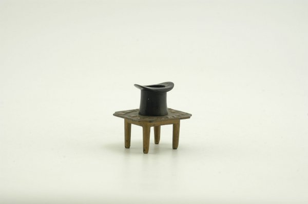EARLY N.J. CAST IRON MATCH STICK HOLDER: Cast iron, painted in gold table with black top hat, embossed table top reads, "H. H. Curtis' Red Bank N.J." very early and interesting. These were placed alongside stoves. 3 1/2" x 3 1/2"