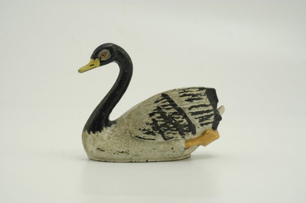 SWIMMING SWAN DOORSTOP: Rare, flat back style, #124, elegant swan is painted w/black neck and feather tips, yellow beak and orange feet. 5 1/2" h. 7 3/8" w.