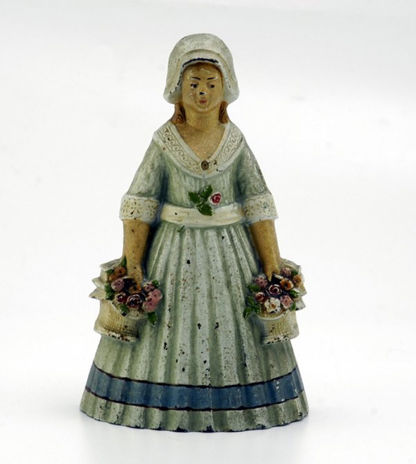 WOMAN HOLDING FLOWER BASKETS DOORSTOP