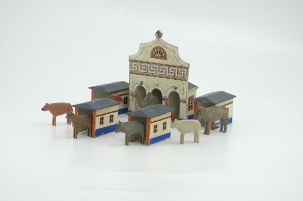 ERZEBIRGE STABLE AND BARNS: Germany, featuring a wooden three stall stable accompanied by four small barns in matching paint, together w/eight Noah's Ark animals not original to this set. 6" h.
