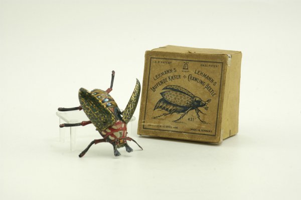 BOXED LEHMANN CRAWLING BEETLE: Germany, lithographed tin toy depiction of a May beetle, fascinating and clever clockwork action, movement allows crawling and wings to flutter, very colorful. 4 1/2" l.