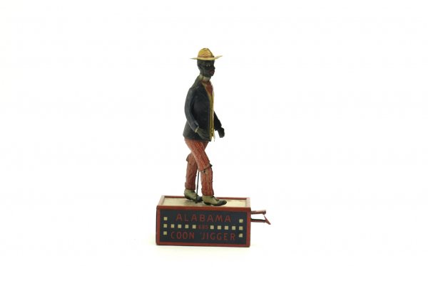 LEHMANN ALABAMA COON JIGGER: Germany, lithographed tin, classic dancing figure on clockwork, concealed stage box, very colorful example. Not Working, 11" h.