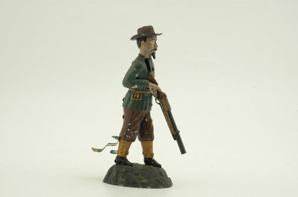 BUFFALO BILL TARGET SHOOTER: Gunthermann, Germany, hand painted tin, depicts famed Buffalo Bill with rifle in hand, lever action, originally sold as "Le Champion." 9" h.