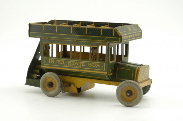 STRAUSS INTER-STATE BUS: Lithographed tin, green and yellow body version, upper deck seating w/full rear stairs, keywind seated driver. 10" l.