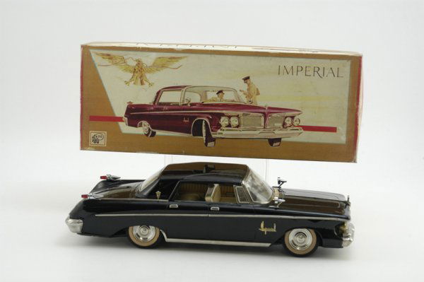 1962 CHRYSLER IMPERIAL: Ashi Toys, Japan, striking black example, fresh to market, cream litho interior seating, a classic luxury auto, well appointed w/nickel finish, box is not original but a nice go-along display. 15" l.
