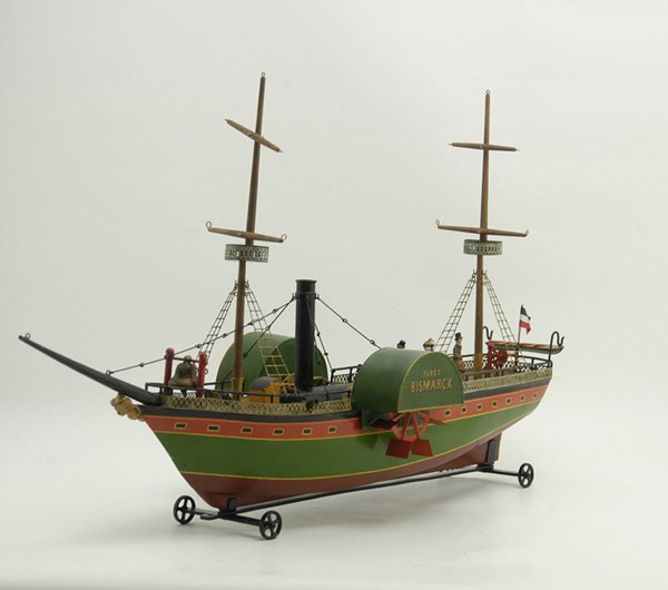 ROCK & GRANER "FURST BISMARK" WITH WOODEN BOX: 1875, this 134 year old steam driven toy ship was found 15 years ago in South America and authentically restored by Tin Toy Works. Examples of original R & G N ships were used to match the paint. The 