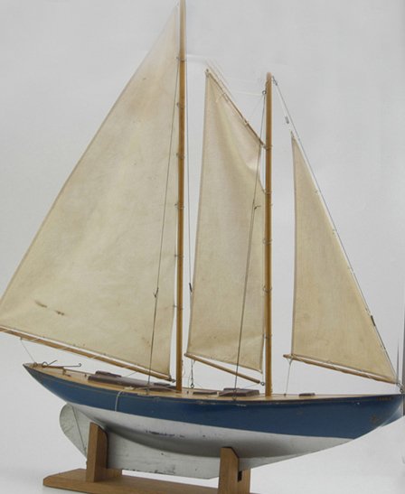 BOUCHER POND BOAT: Another in the Boucher Mfg. patented composition boats, wood mast and cloth sails, and their patented shifting device, embossed latch covers on deck. 30" l.