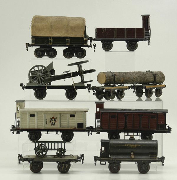 GROUPING OF MARKLIN FREIGHT CARS: Interesting mix of train cars includes beer van, oil car, coal car with brake house, log wagon, covered car, field cannon carrier, farm wagon on flat bed, and box car w/brake house, gauge 1, all hand 