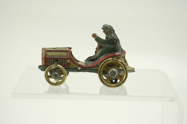 ROADSTER PENNY TOY: Brightly lithographed open roadster w/boat tail rear, flywheel operated, articulated motion causes driver's hand to raise and lower when moving. 3 1/4" l.