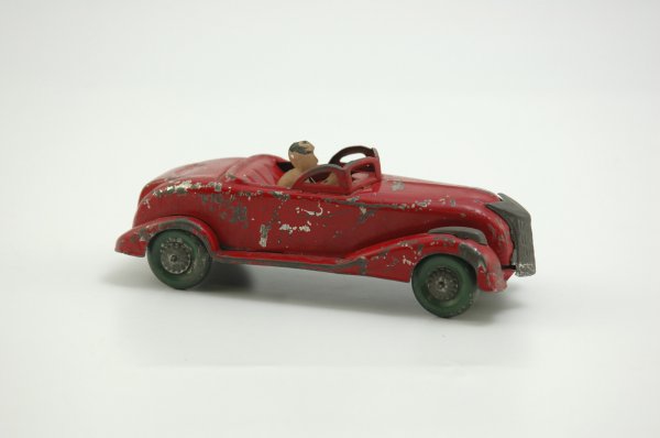 UNUSUAL 1935 CHRYSLER CONVERTIBLE: Unknown manufacturer, keywind, tinplate finished in red w/driver and integrated key, steerable front wheels. 6" l.