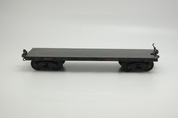 BUDDY 'L' OUTDOOR RAILROAD FLAT CAR: Pressed steel, painted in black, decal reads "96834," stake pockets on sides. 20" l.