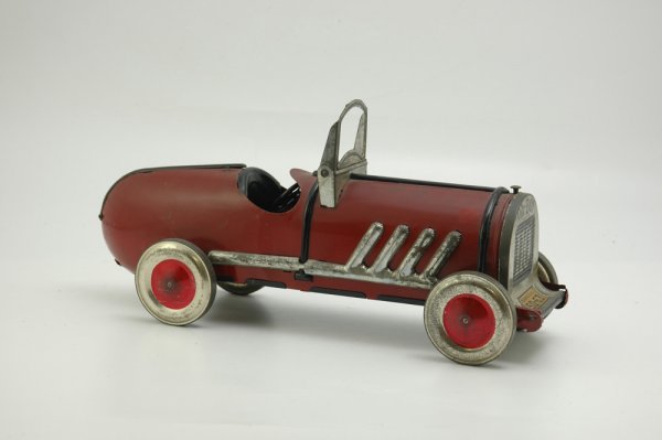 "OH-BOY" AUTO RACER: Kiddies Metal Toys, large scale tin plate racer, features colorful decals on boat tail rear and grille, embossed exhaust pipes on sides, large balloon wheels. 18 1/2" l.