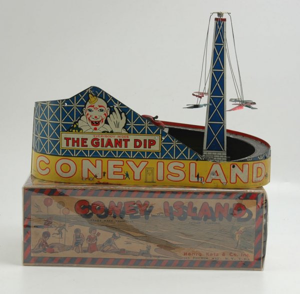 BOXED CONEY ISLAND "GIANT DIP RIDE" TOY: Henry Katz, scarce example, lithographed tin, depicts the famous Giant Dip coaster, features circling airplanes on high tower, clockwork driven. 13 1/2" h. x 17 1/2" w.