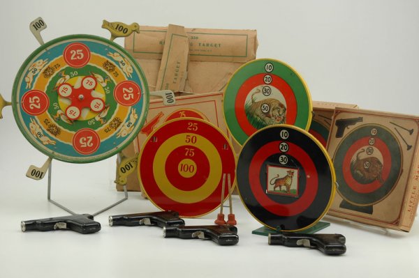LOT OF FOUR HOGE TARGET GAMES: Tin lithographed target boards, includes three boxed Little Marksman sets with (VG Cond.) boxes, and Revolving Bird Target board with mechanical action, includes toy pistols, bird box is tattered. 7 1