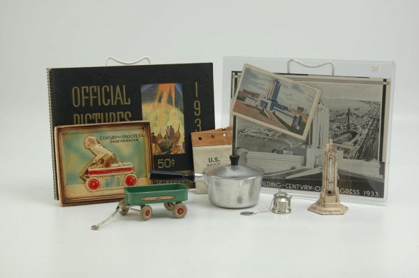 CENTURY OF PROGRESS SOUVENIR LOT: Large grouping includes 1937 plaster wall plaque, Havoline Tower Thermometer, miniature US Mail bag, Radio Flyer wagon with decal, post cards and official picture book, tea strainer with metal tag and