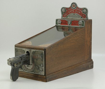 BIG GAME HUNTER SKILL COIN-OP GAME: ABT Mfg Co., target shooter, five shots for 1 cent, hit targets and revolve wheels, ornate marquee, wooden cases. 26" l x 18" h.
