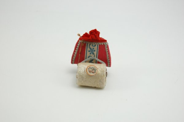 DRESDEN PURSE AND SPUN COTTON MUFF: Consists of a spun cotton muff filled with pinecone and fir with chenille strap along with a red linen purse with Dresden decor and a replaced drawstring top. 2" - 3 1/4" l.