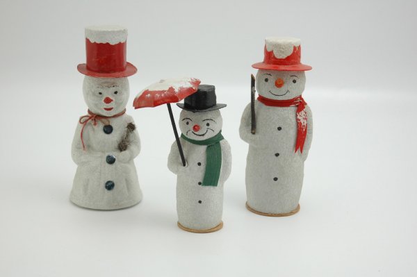 LOT OF THREE SNOWMAN CANDY CONTAINERS: Whimsical examples, largest depicts snowman in red top hat with human like molded facial features, smallest carries an umbrella in hand, wears green papier mache scarf and is stamped "Western Germany"