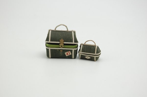 TWO PIECES OF LUGGAGE CANDY CONTAINERS: Dresden, Germany, great go along with dolls or Christmas trees, both pieces are covered in dark green crepe paper, handled at tops, larger has metal key escutcheon, charming examples. 2" to 3".