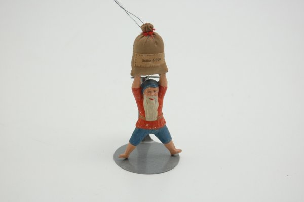 DWARF WITH MONEY BAG ORNAMENT: Full bodied dwarf carries cloth money bag overhead, wears red shirt and blue pants. 3 1/2" h.