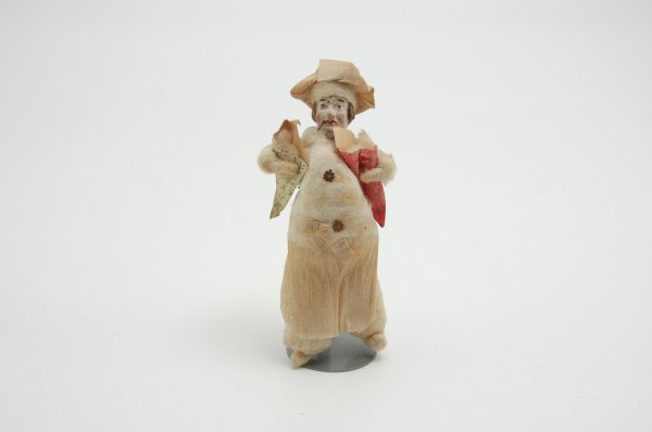 GERMAN SPUN COTTON BATTING BAKER MAN: Delightful example, baker holds two paper bags in hands while smoking, hand painted papier mache head and crepe paper apron. 6" h.