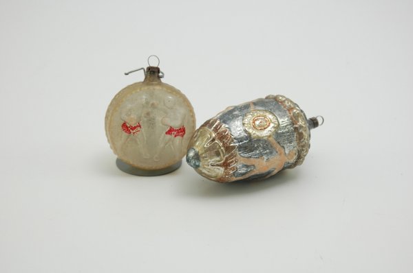 LOT OF TWO GLASS ORNAMENTS: Includes a brightly painted, elongated acorn with dancing boys accompanied by a disk shape portraying sparring boxers in red trunks. 2 1/2" to 4" h.