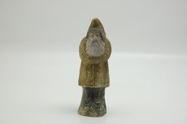 GOLD FINISHED BELSNICKLE: Germany, papier mache with full molded beard, figure stands in usual crossed arm pose, grey chenille trim to hood, solemn look on face with prominent eyebrows. 10 1/4" h.