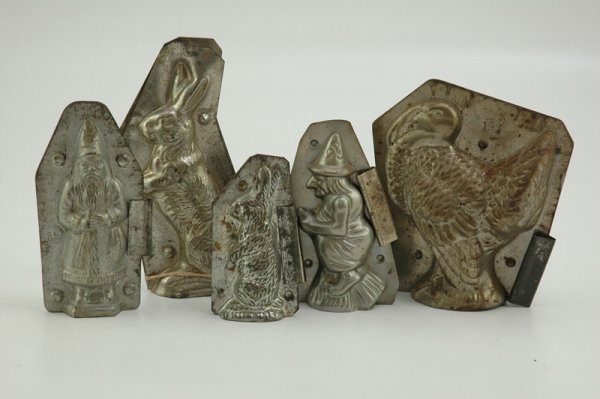 LOT OF FIVE CANDY/CHOCOLATE MOLDS: All holiday themed, group includes early Santa #59, Jaburg Bros. rabbit #6, small rabbit on hind legs #467, witch on broom #218 and a Tom Turkey #193, Santa example has an additional #167 on top of on