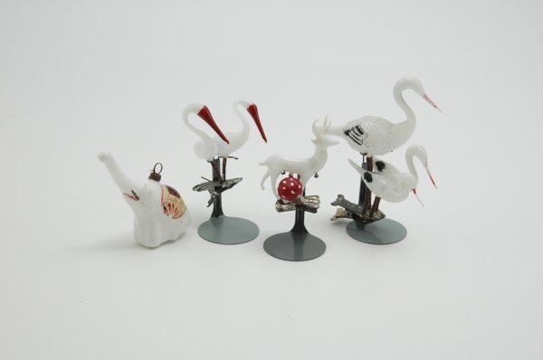 LOT OF MILK GLASS ANIMAL ORNAMENTS: Excellent detail and molding, consists of two clip-on storks examples, an elephant with upright trunk (small chip at stem top) and deer standing by mushroom. 2 1/2" to 4 1/2" h.