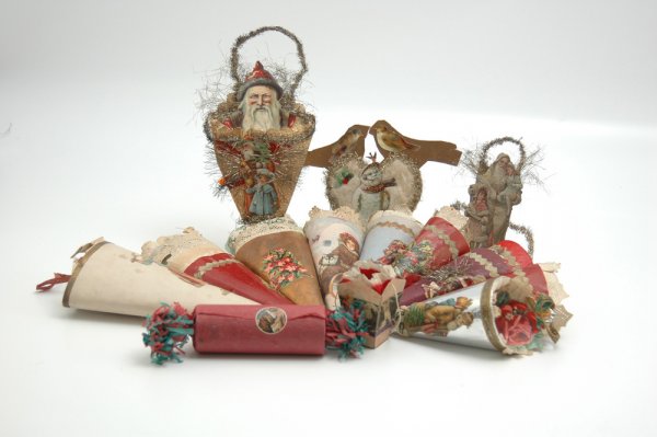 GROUP OF CORNUCOPIA CANDY CONTAINERS: Consists of sixteen containers featuring a decorated Dresden bird and unopened Christmas popper from a Golden Glow convention containing a "Lester Branager'" redware Santa; also includes wire and tins
