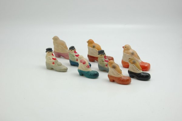 LOT OF NINE CELLULOID CHICKENS IN SHOES