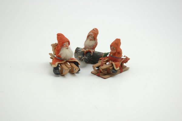 GROUP OF THREE COMPO FACED SANTAS