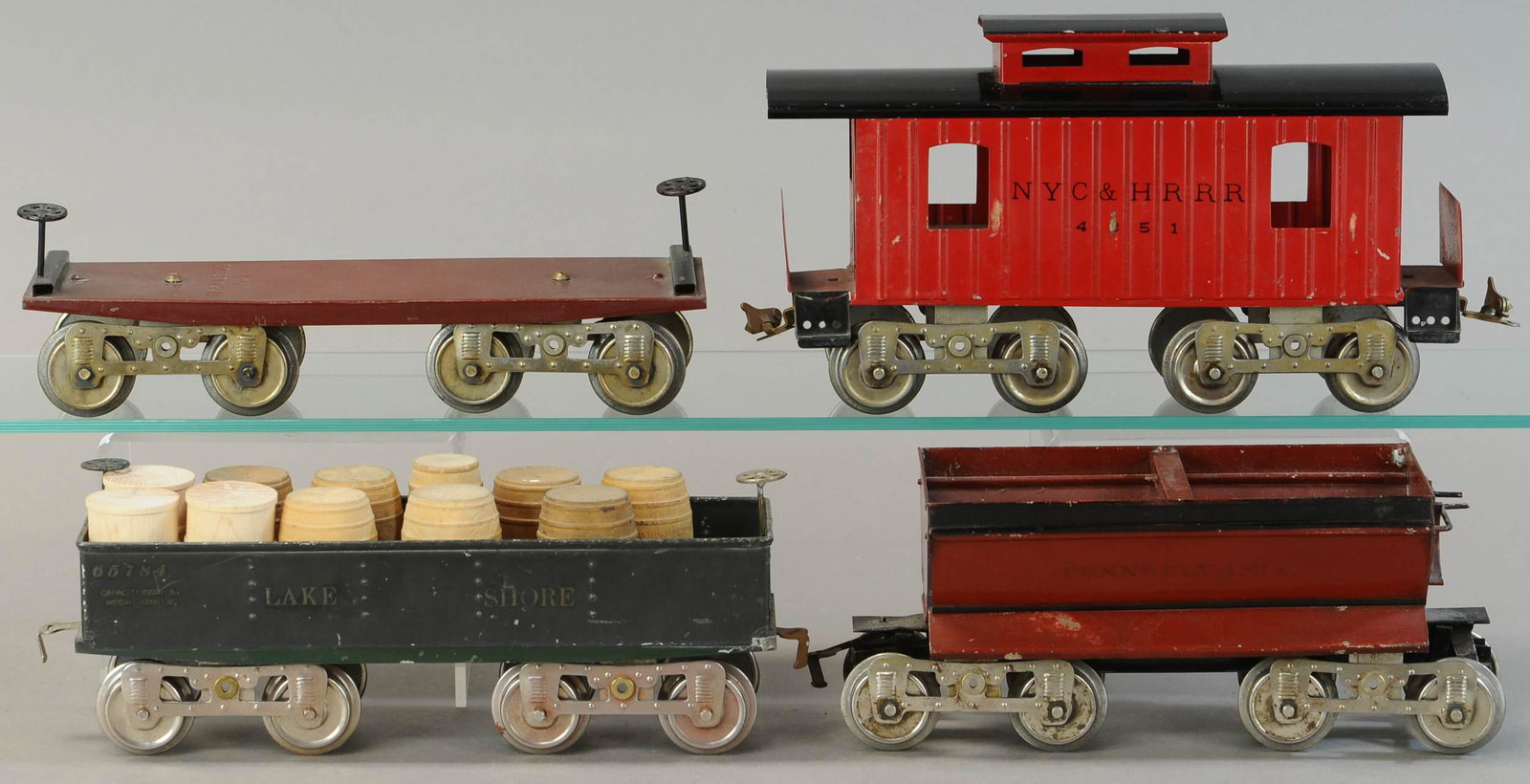 LIONEL AND BING STANDARD GAUGE CARS: 1085. LIONEL AND BING STANDARD GAUGE CARS | Standard gauge. | 12.5" l. | Three wooden barrels are replacements, otherwise in All original condition. | $250 - $500