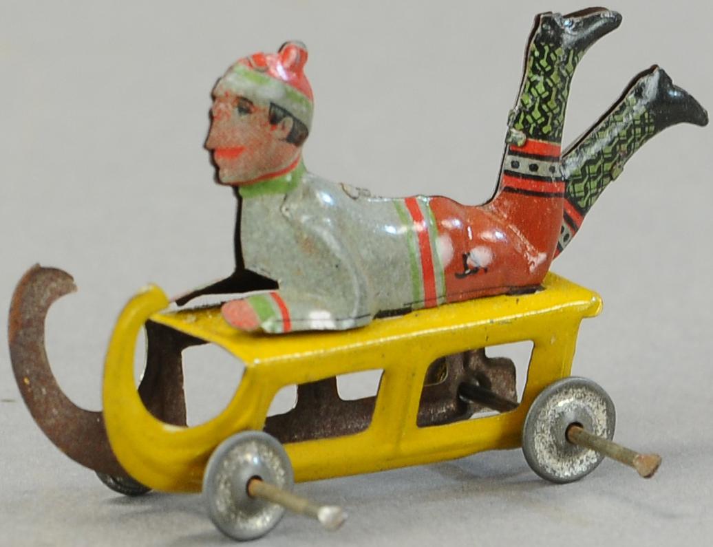 SMALL MEIER BOY ON SLED PENNY TOY (1 of 3)