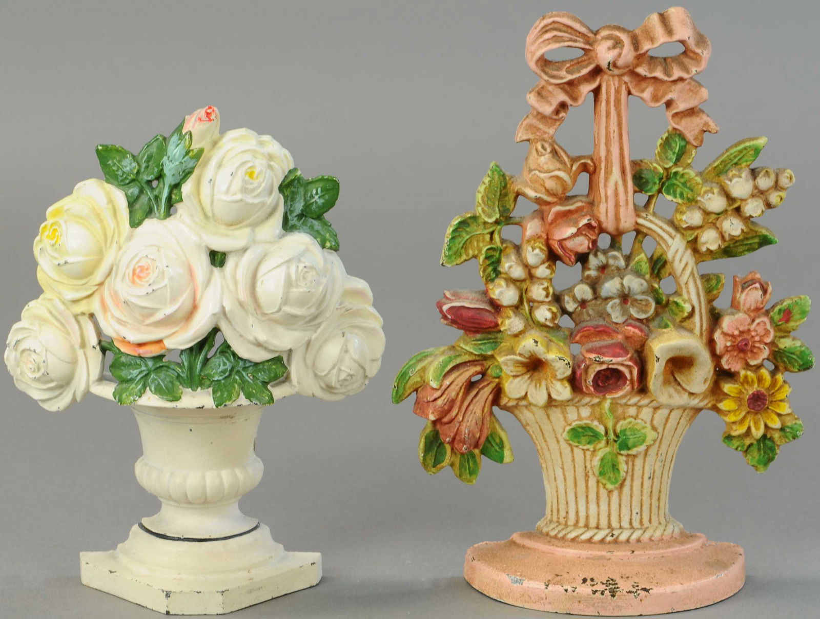 ROSE VASES AND LILIES OF VALLEY DOORSTOPS: 1330. ROSE VASES AND LILIES OF VALLEY DOORSTOPS | Hubley. | 9" to 10.5" h. | (Pristine to Near Mint Condition). | $200 - $400