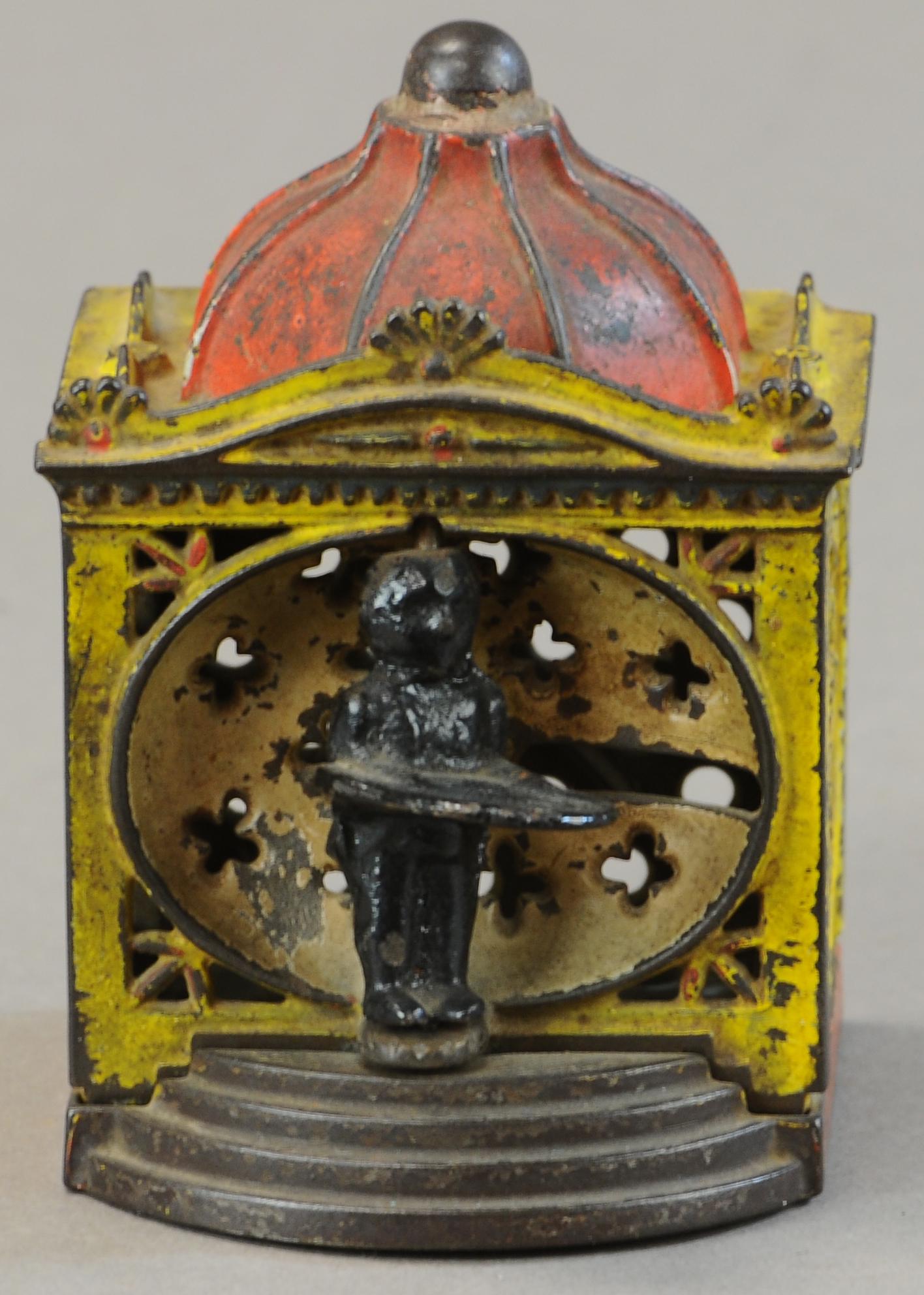 HALL LILLIPUT MECHANICAL BANK - YELLOW (1 of 3)