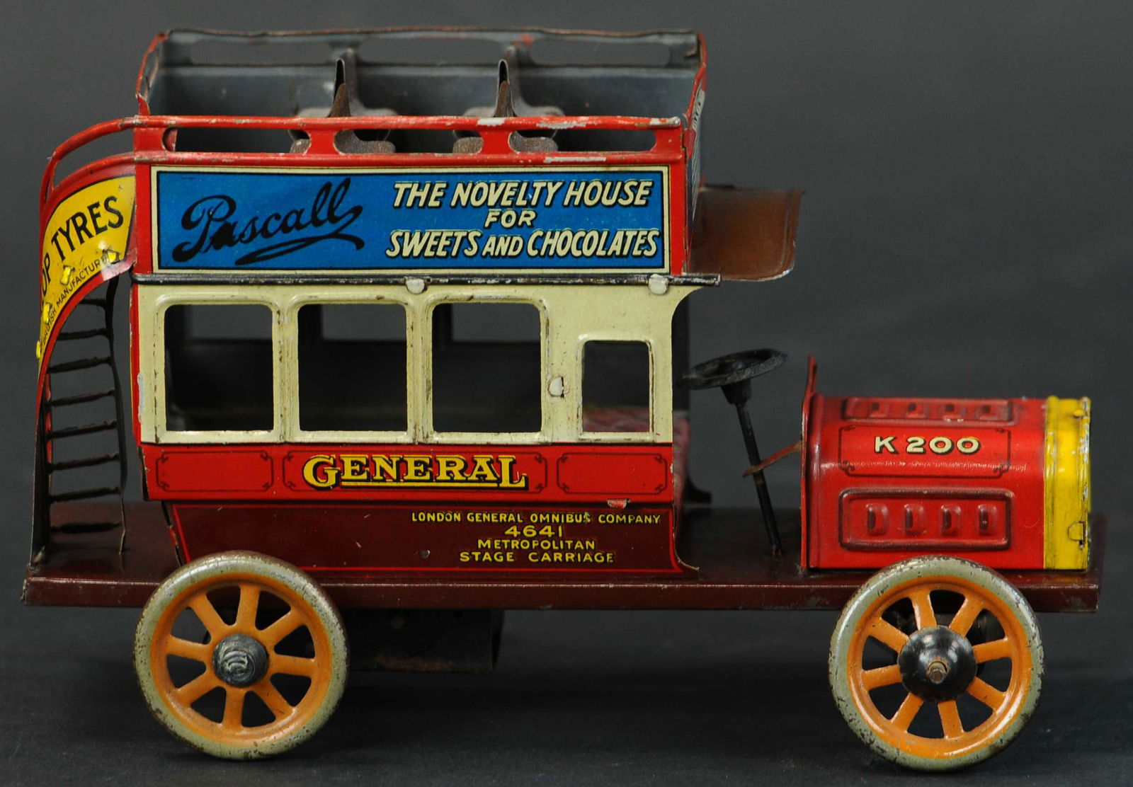 BING ADVERTISING DOUBLE DECKER BUS: 14. BING ADVERTISING DOUBLE DECKER BUS | Seldom seen with colors on the advertisements in this small size, a very charming piece of German automobile toy making. | Provenance: Paul Cole Collection. |