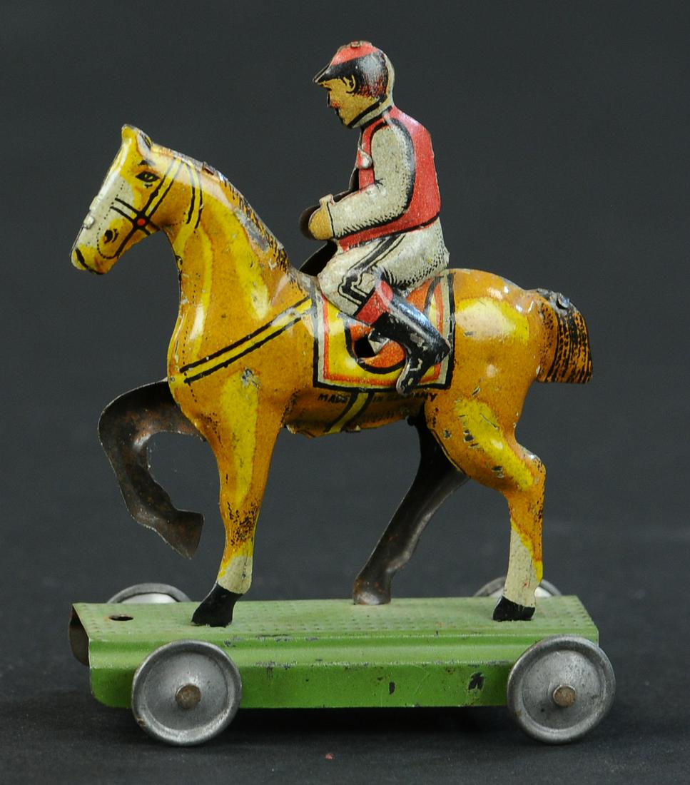 JOCKEY ON HORSE PENNY TOY (1 of 2)