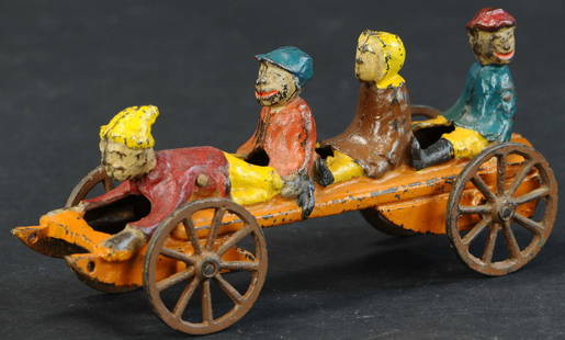 DOUBLE RIPPER SLED BELL TOY: 280. DOUBLE RIPPER SLED BELL TOY | Extremely rare NN Hill Brass Co. toy with only a handful examples known, depicts children seated at sled with spoke wheels apparently enjoying a ride downhill. | Pro