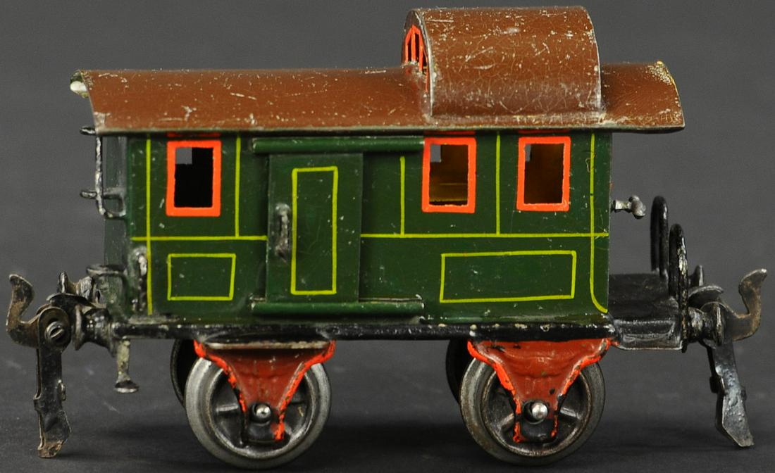 MARKLIN BAGGAGE CAR: 563. MARKLIN BAGGAGE CAR | 0 Gauge, hand painted, sliding door on each side. | Provenance: Paul Cole Collection. | 5" l. | Some minor touchups to green body, otherwise (Excellent Condition) | $250 - $