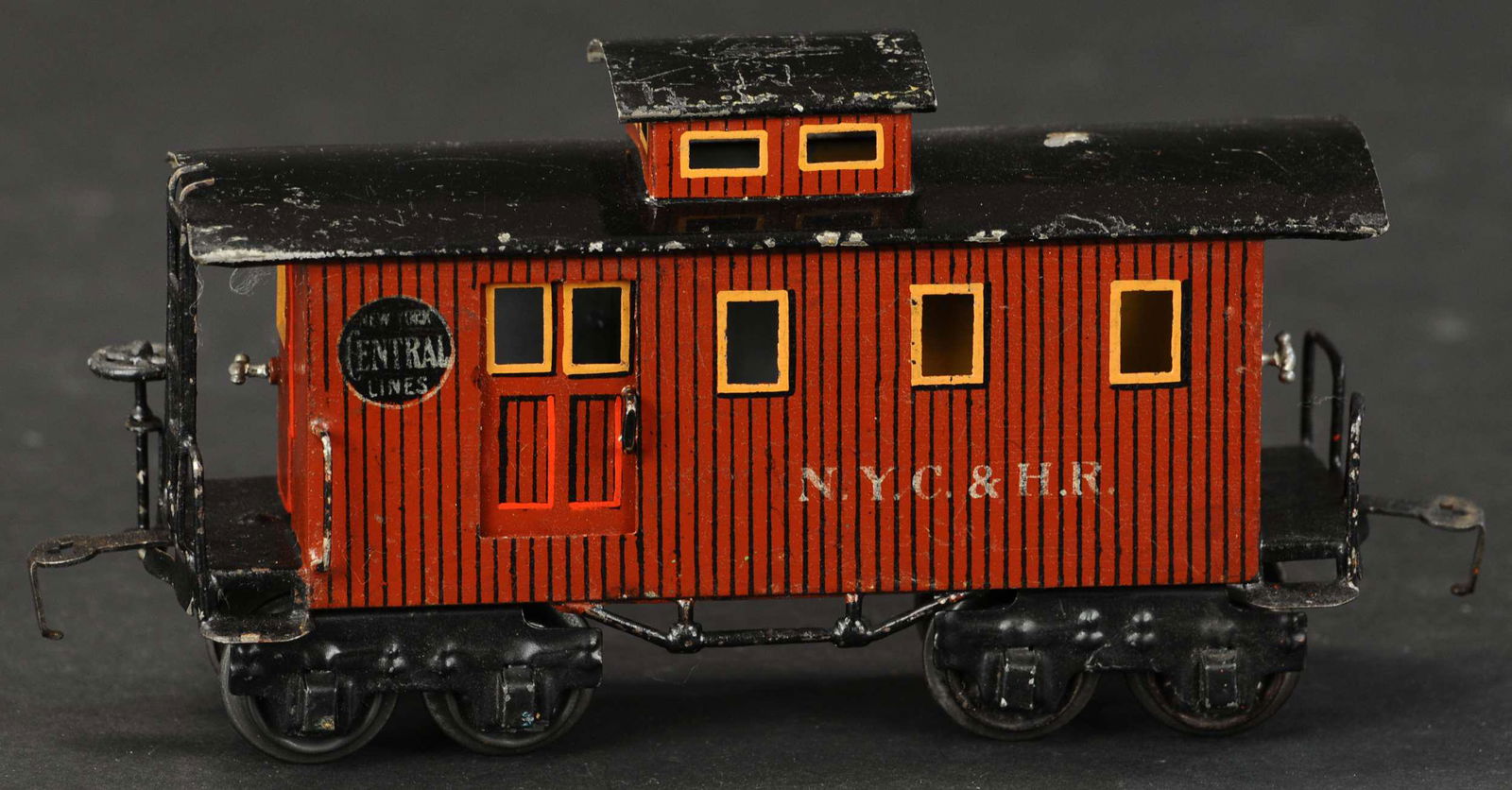 MARKLIN NYC & HR EIGHT WHEEL CABOOSE: 755. MARKLIN NYC & HR EIGHT WHEEL CABOOSE | O gauge, hand painted, features Marklin's American spec couplers that are compatible with Ives and Flyer, missing chimney from roof, catalog no.2934, circa
