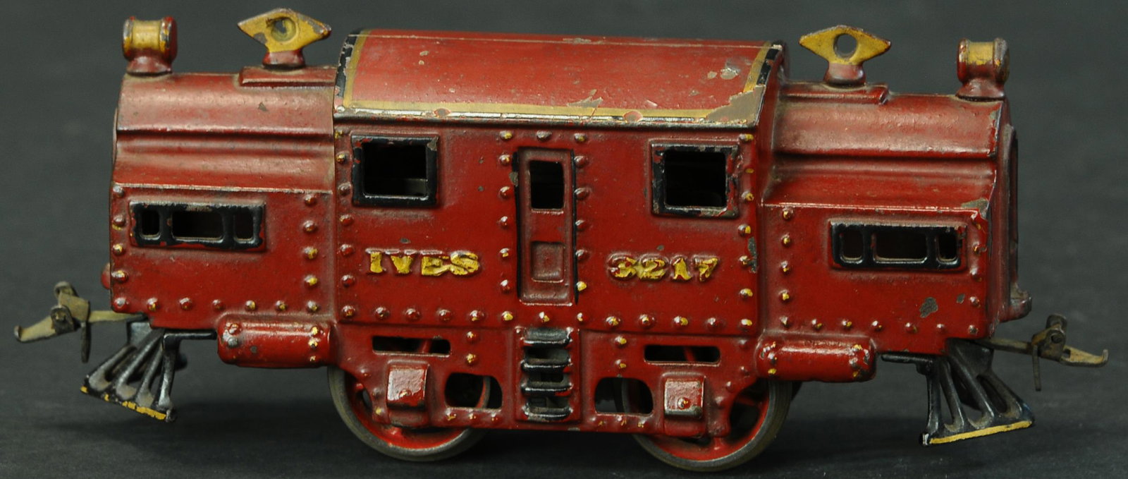 RED RAISED LETTERED IVES #3217: 831. RED RAISED LETTERED IVES #3217 | O gauge, electric, hand painted in red with raised lettering. | Provenance: Paul Cole Collection. | 7" l. | (Excellent Condition) | $300 - $500