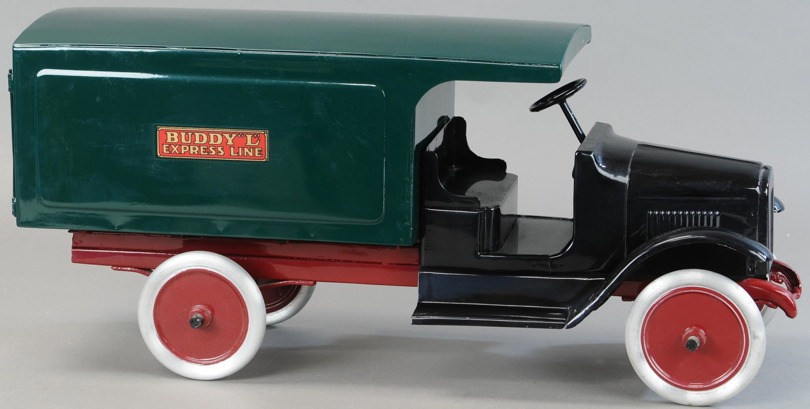 BUDDY L EXPRESS LINE TRUCK: 67. BUDDY L EXPRESS LINE TRUCK | From the Butch Buss Collection. | 25" l. | Original truck has been Professionally Restored. | $250 - $500