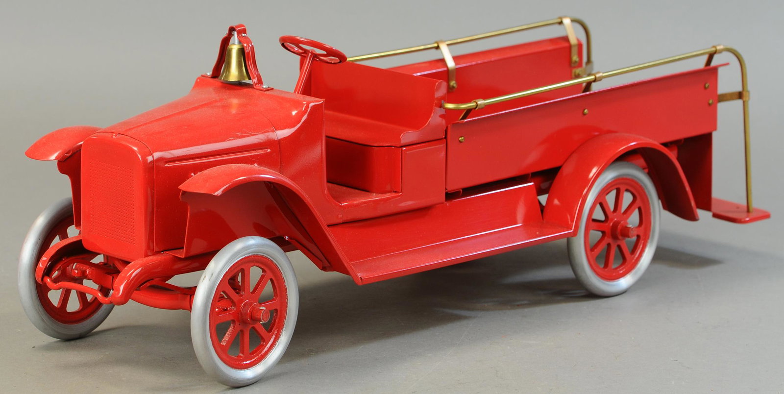 BUDDY L EXPRESS FIRE TRUCK - SPOKE WHEEL: 119. BUDDY L EXPRESS FIRE TRUCK - SPOKE WHEEL | 26" l. | Contemporary Example. | $200 - $400