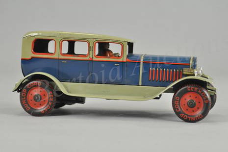 DISTLER SEDAN WITH LIGHTS: Germany, late 1930's, lithographed tin, done in blue body, light green roof and running boards, seated driver, black and red disc wheels, clockwork driven. 10 1/2" l.