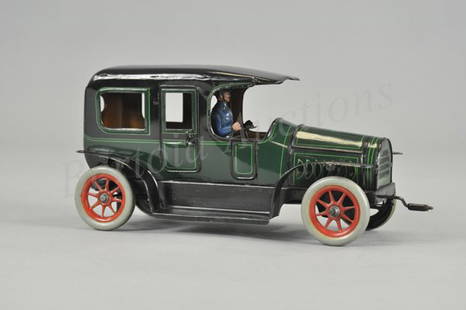 GUNTHERMANN LIMOUSINE: Germany, c. 1920, lithographed tin, done in green body black roof and full running boards, features front cranking clockwork mechanism. 10" l.